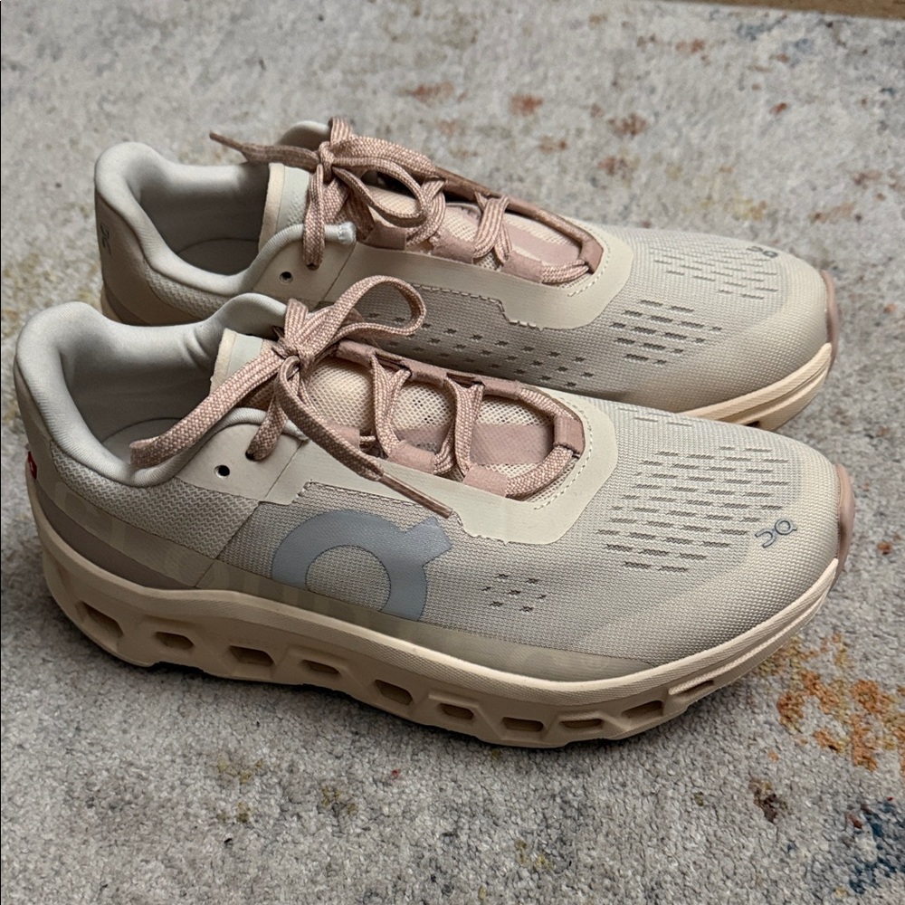 On Running Women's Beige and Pink Sneakers, nice and clean.